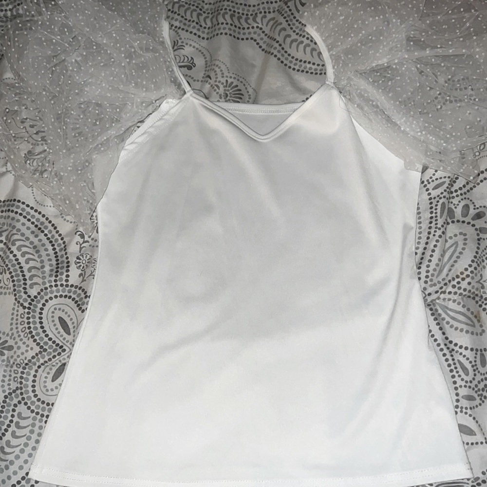 A white Lacey puffy sleeves with polkadots